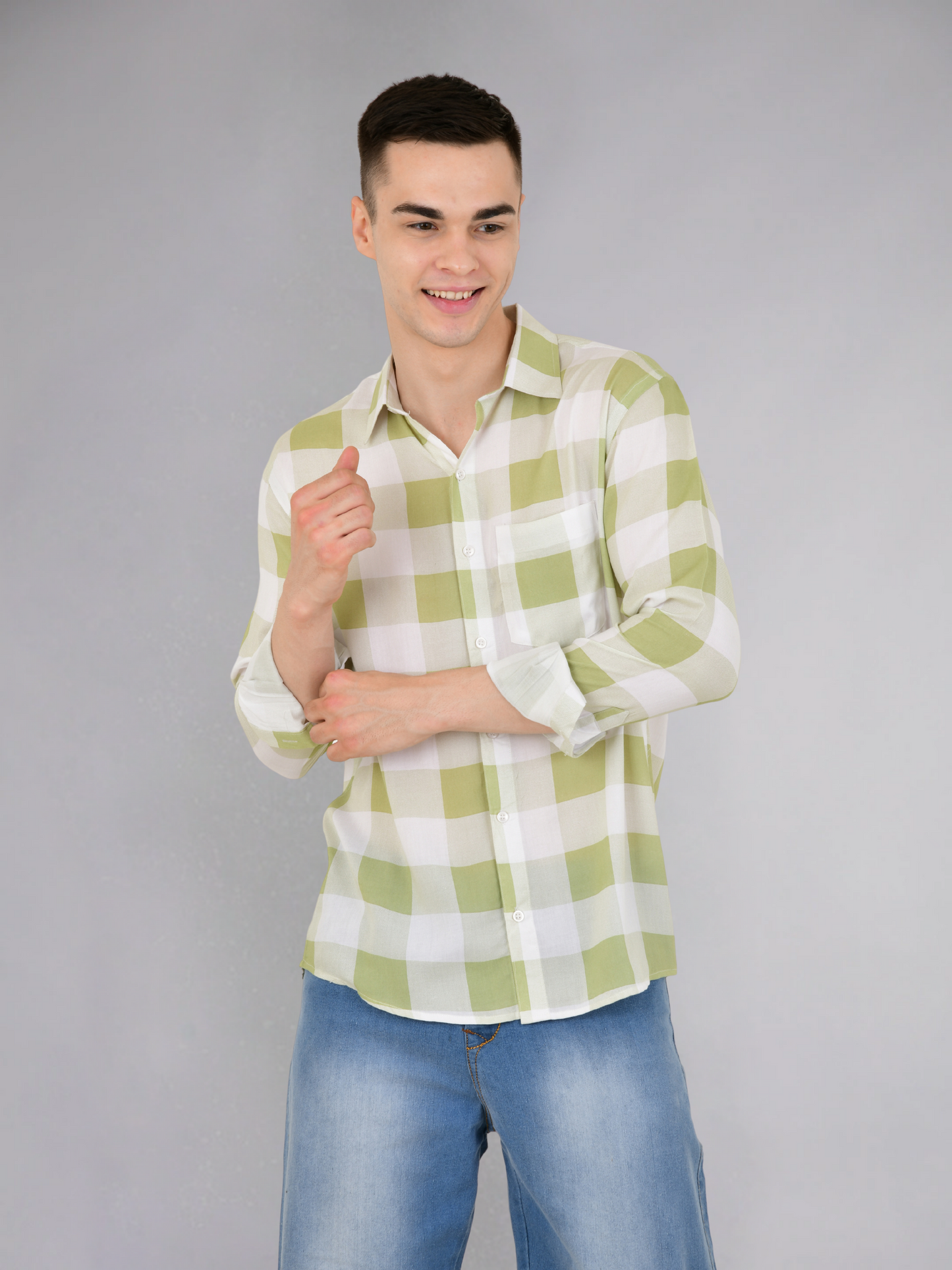 Folded green check cotton shirt, displaying pattern and texture