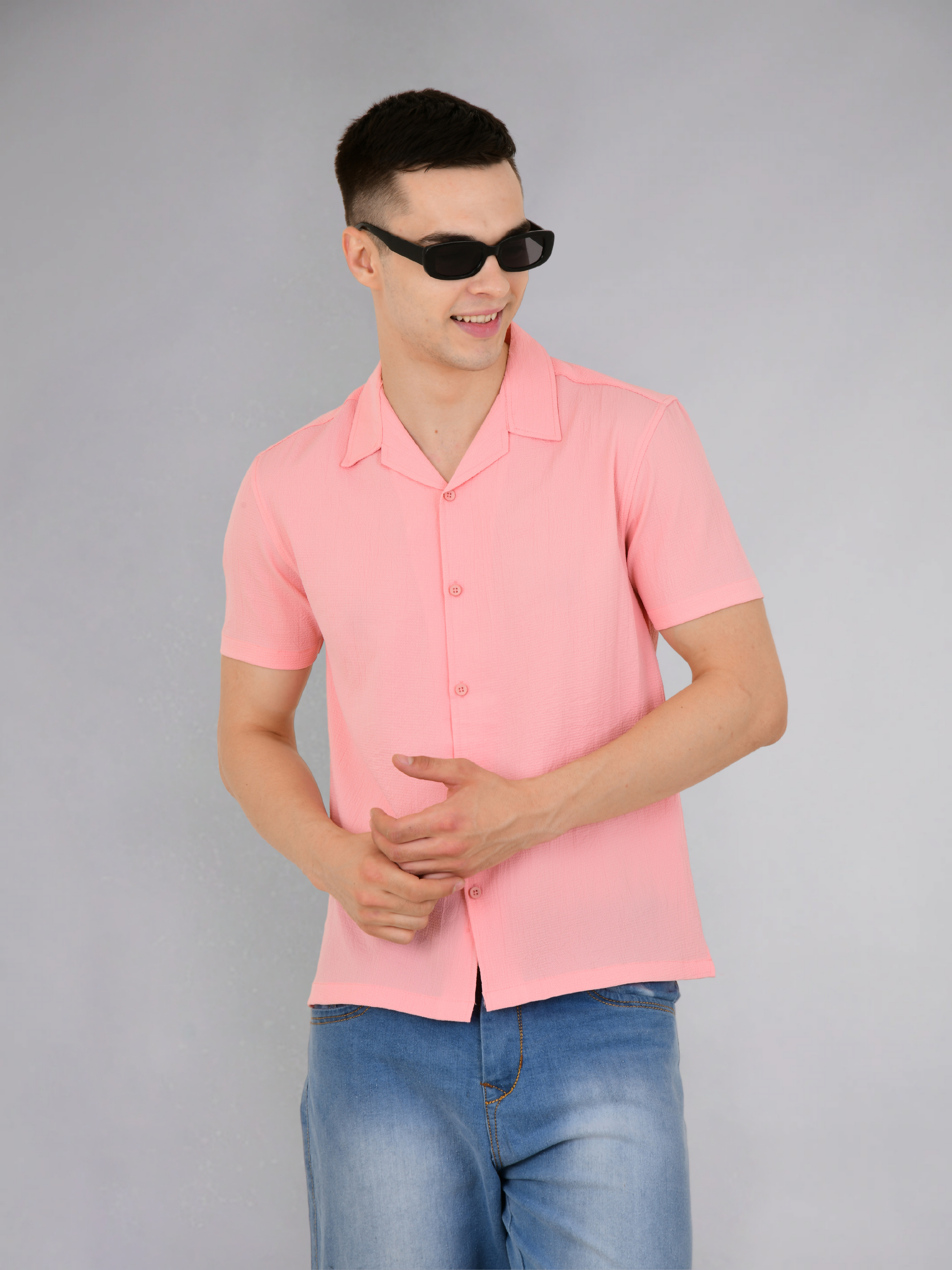 Side view of a pink popcorn texture shirt highlighting its unique texture