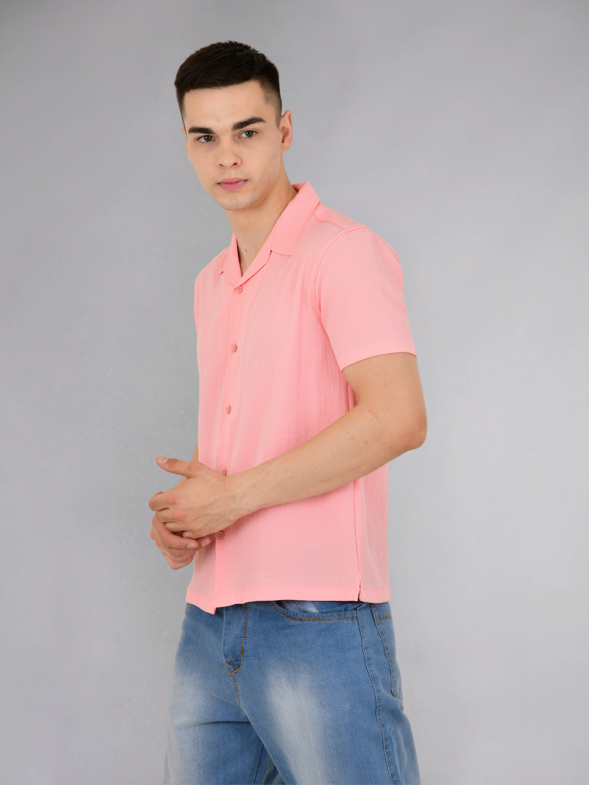 Model wearing a pink popcorn texture shirt with half sleeves